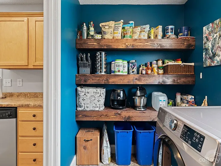 Walls are now a lighter blue in the pantry/laundry room.
