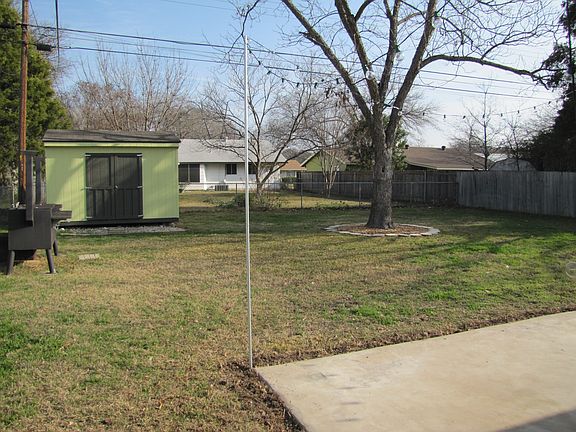 Yard w/ storage and bbq pit