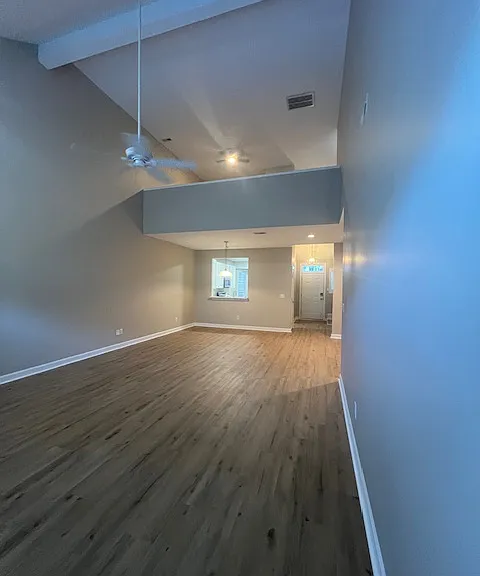 family room view with loft upstairs