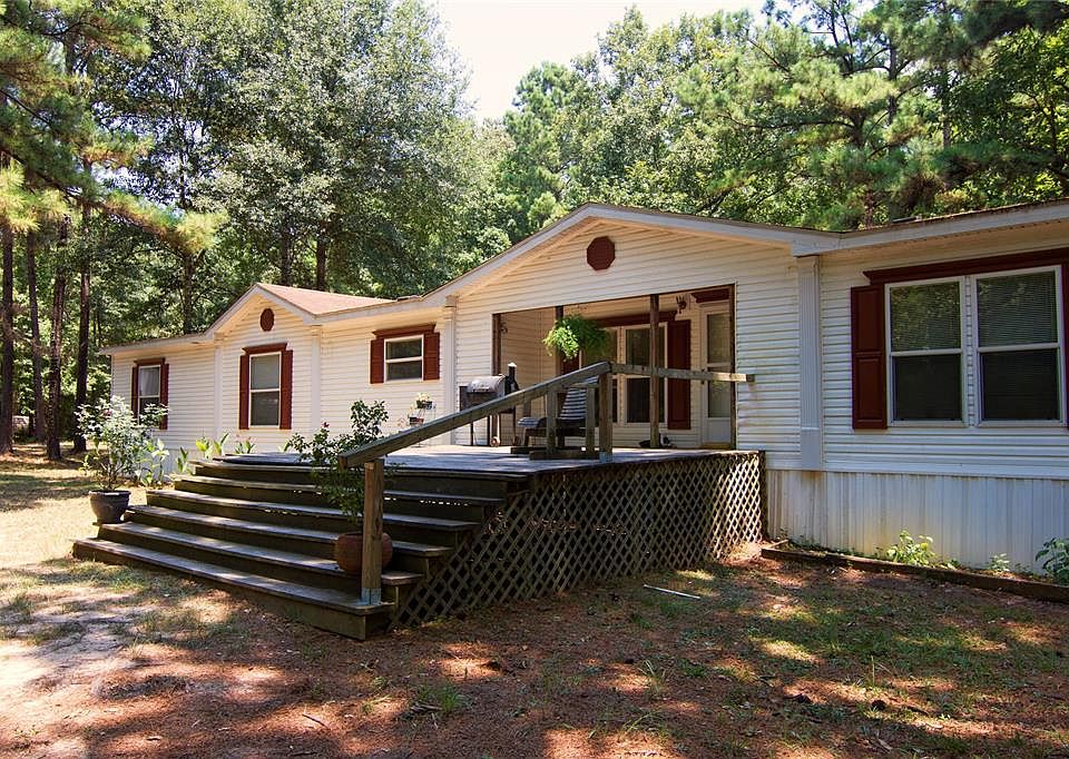 This meticulously maintained home sits on over 12 acres and is a nature lovers dream!