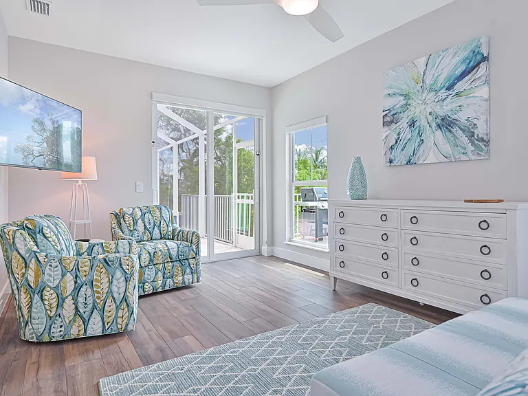 Primary main floor bedroom-view to the pool