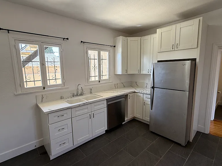 Custom Cabinetry with Kohler Brand Undermount Kitchen Sink and Newly Installed Quartz Countertops