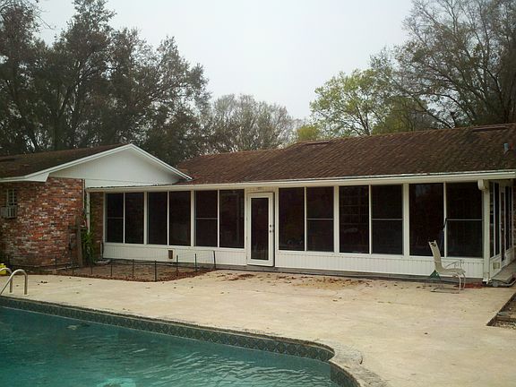 big sunroom, pool and deck