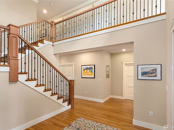 2 story entry, custom cherry banister & rails, hardwoods throughout most of main floor.