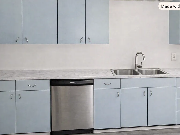 Kitchen boasts Mid-Century Modern cabinets, new countertops, new microwave, subway tile backsplash, SS dishwasher (this photo will be updated tomorrow to show the SS double basin sink). Also, refrigerator and stove are in the kitchen.