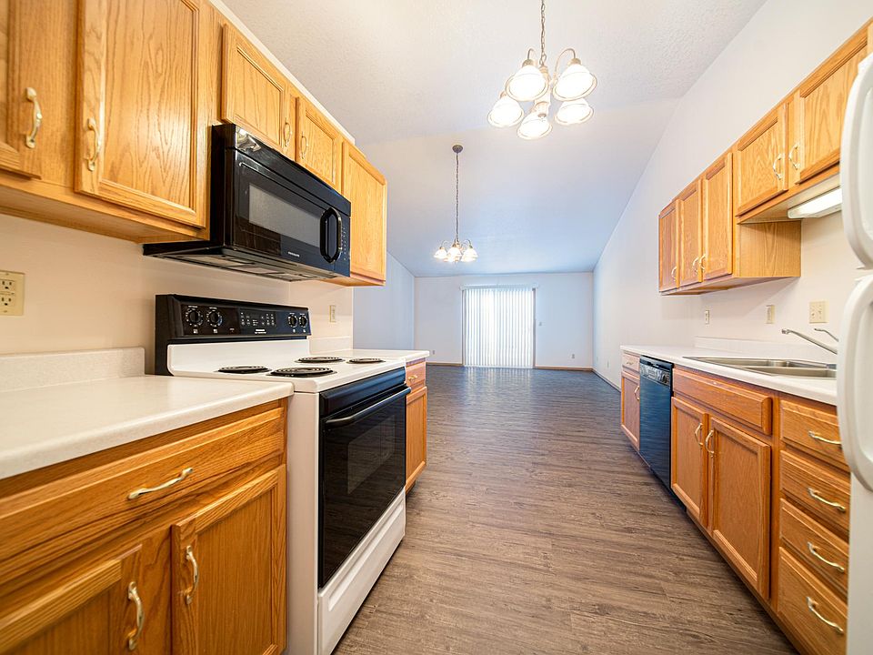 Prairie Mill Townhomes: Kitchen and Living Area with Vinyl Flooring