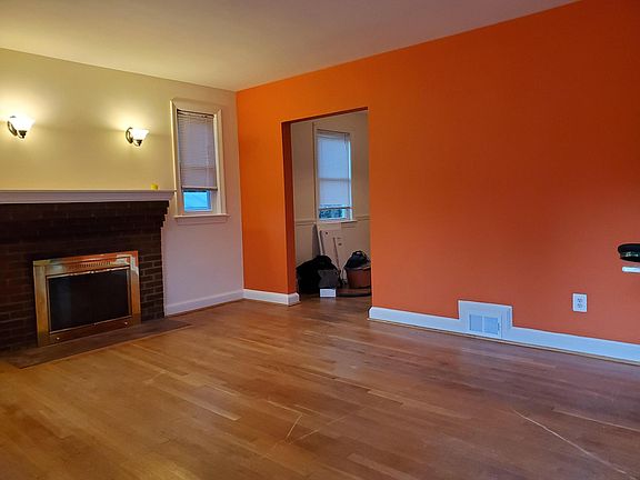 Living room. (Wall has been painted neutral tone)