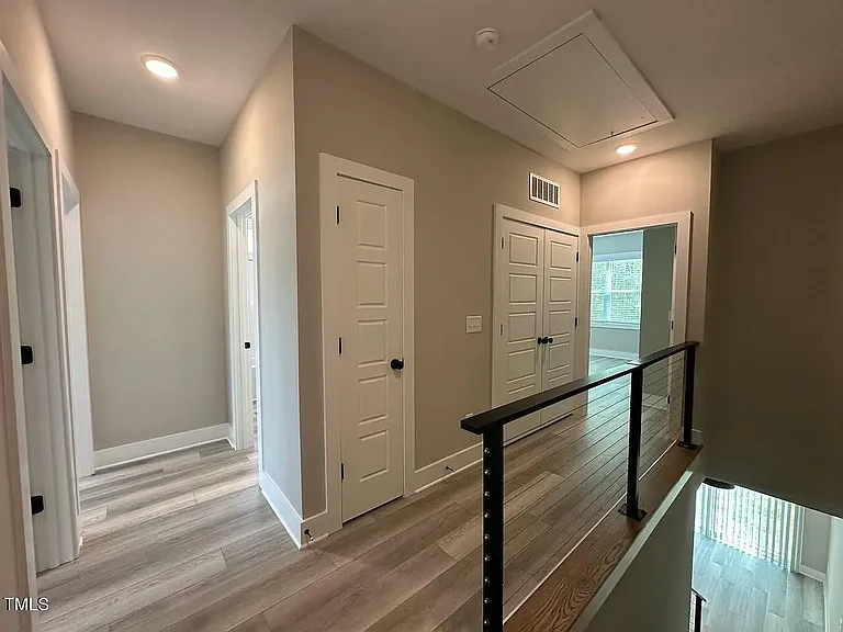 Upstairs hallway with cable railings and low maintenance flooring
9' ceilings on both the first and second floors! Washer and dryer included off the hallway.
