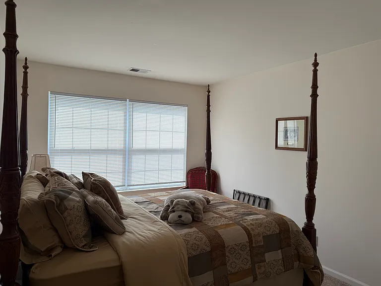 Generously sized second bedroom with large windows and deep closet space - ideal for family, guests, or a spacious dedicated home office