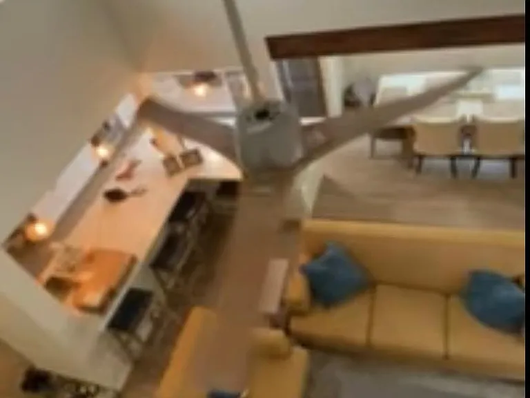 View of living room from upstairs loft bedroom