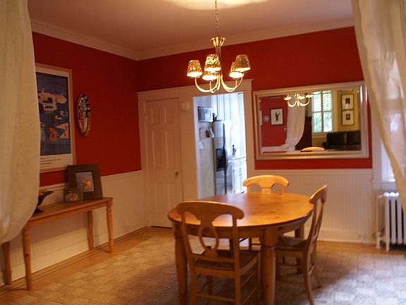 Dining Room complete with crown molding and wainscoting