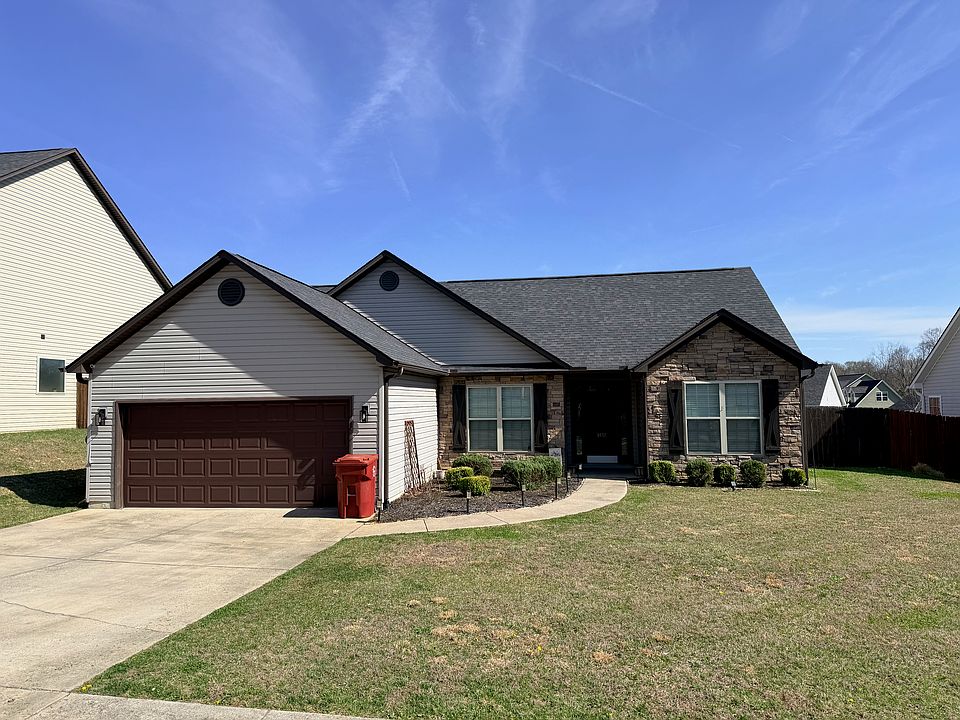 Charming Curb Appeal with Stone Accents and 2-Car Garage