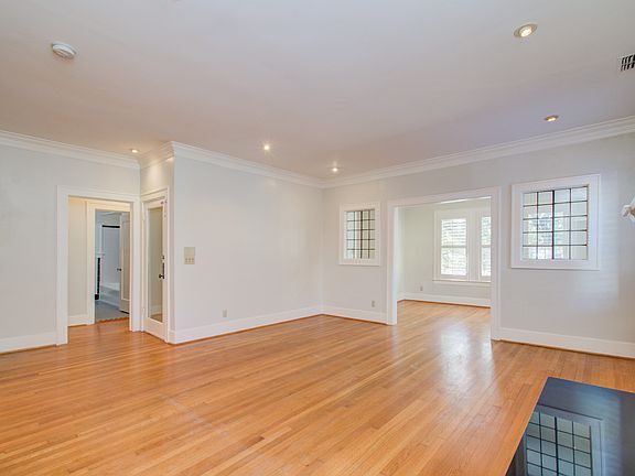 Large living room with side office area
