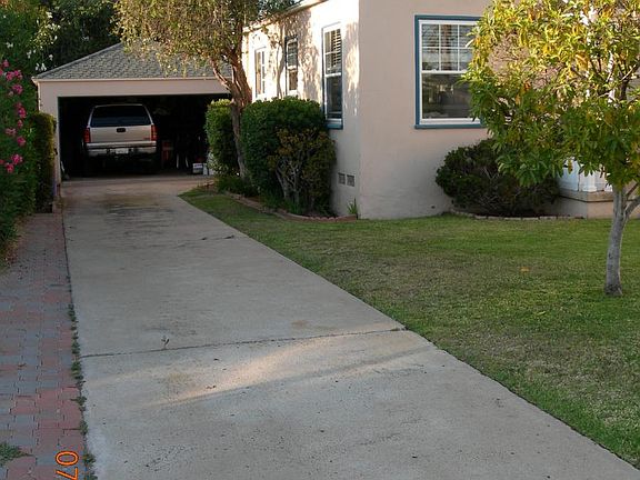 Garage and room in driveway to park multiple cars off street.
Residence can get B permits for street parking as well