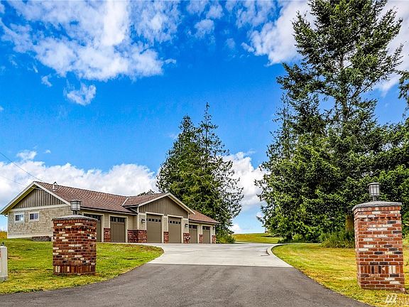 Brick columns define the entrance to this beautiful property. 
