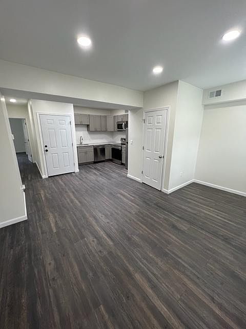 Entryway, kitchen, half bathroom, dining room/common area.