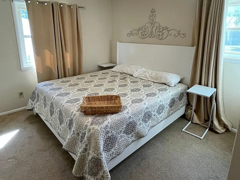 King bed. Both larger rooms are same size & fit a king bed.