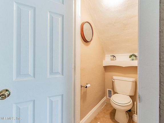 Half bath between living room and dining room