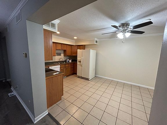 living room leading into kitchen and dinning space