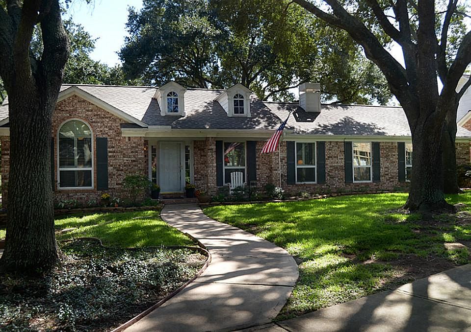 A lovely walk leads to this classic design that showcases casual elegance with a cozy front Porch, s