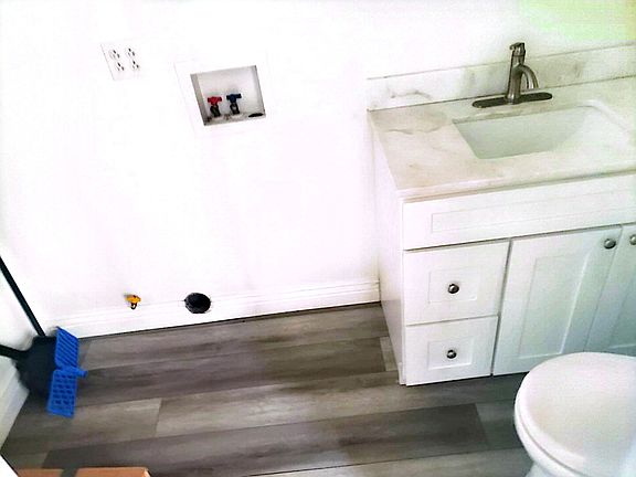 utility bathroom with laundry (washer and drier hookup)