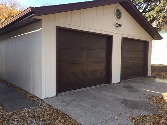 Oversized shared double garage, lots of storage, new insulated doors and openers.