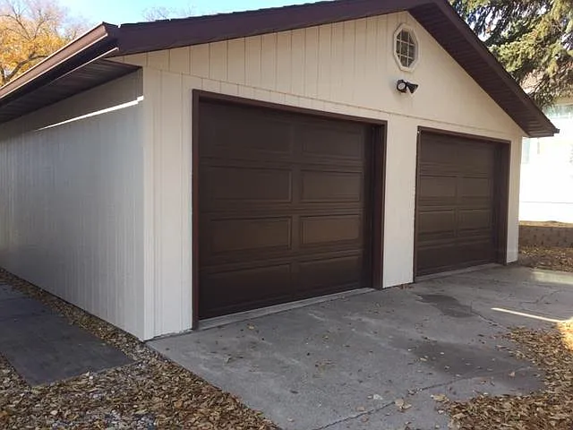 Oversized shared double garage, lots of storage, new insulated doors and openers.