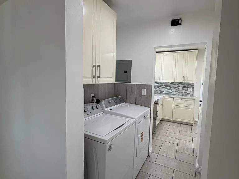 Dedicated laundry with full size washer & dryer