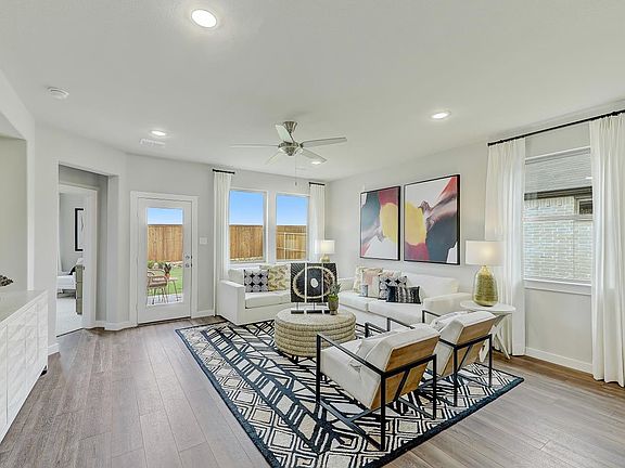 Living room in the Oak home plan by Trophy Signature Homes - REPRESENTATIVE PHOTO
