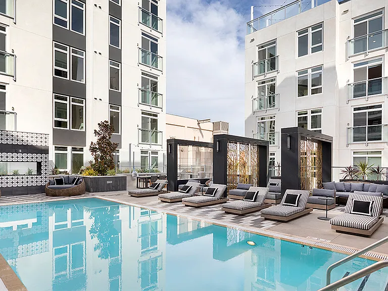 Swimming pool with sundeck, chaise lounges and exquisite outdoor couches