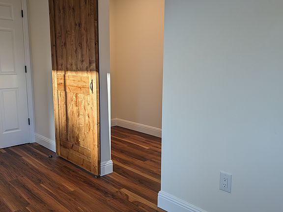 Master Closet with HVAC ducting, power and separate lighting with barn door, could be used for office.