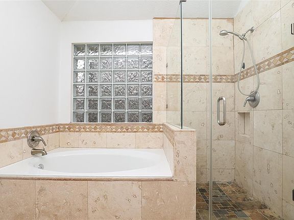 Separate tub and shower.