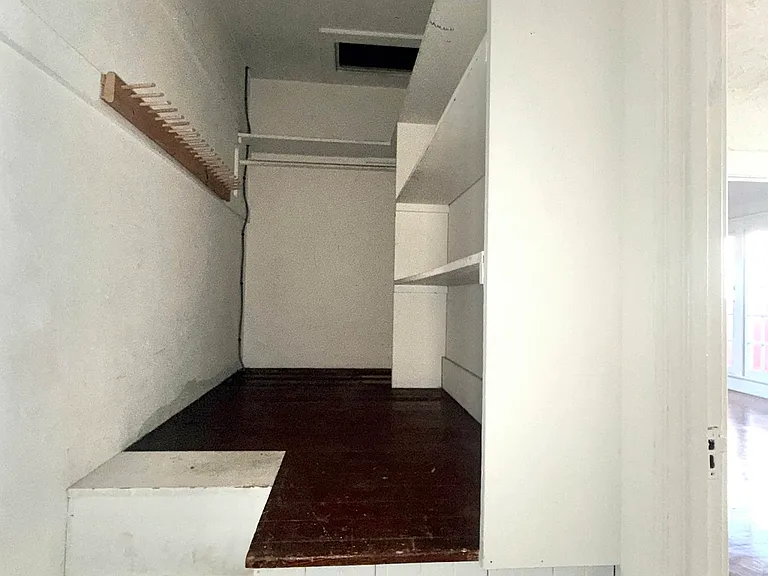 Inside large storage cupboard off dining area