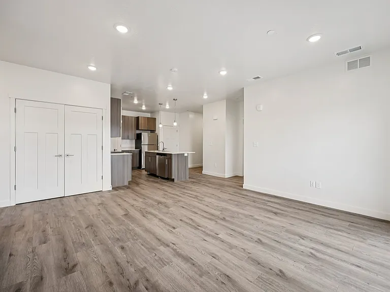 Three Bedroom - View of Kitchen & Laundry Closet from Living Room