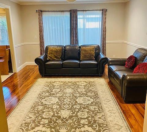 Cozy Family Room with dimmable recessed lighting and ceiling fan
