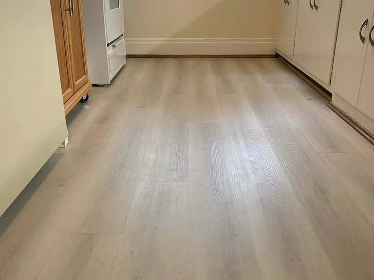 A closer look at the LVP flooring in the kitchen installed in 2025.