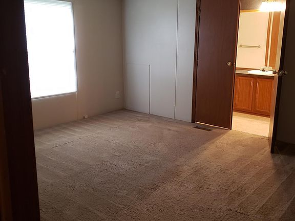 Master bedroom showing bathroom entry