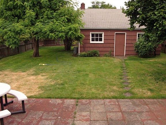 Huge 7000 sq. ft. lot with patio and oversized 2 car garage with alley access.