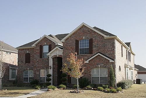 Upgraded Stone Elevation with a covered entryway