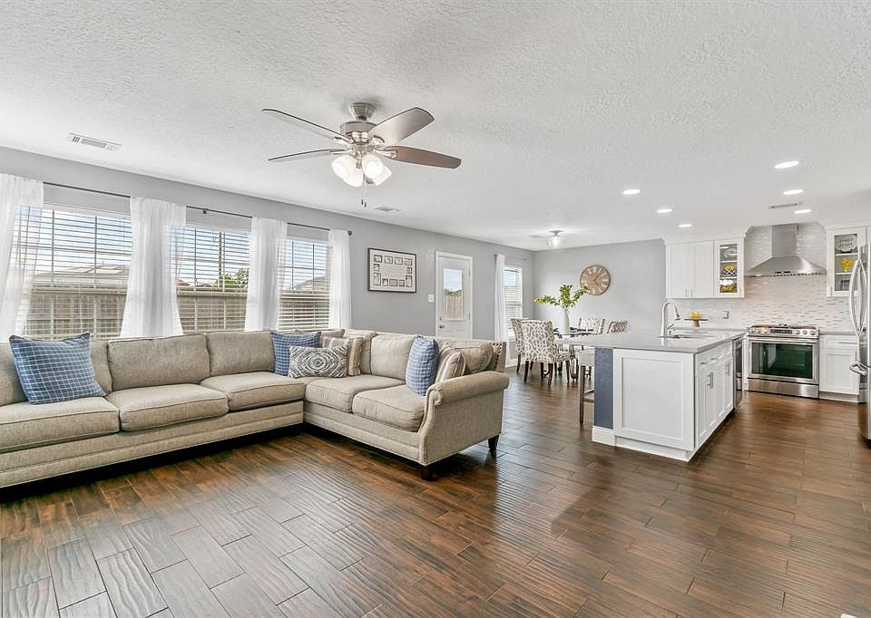 Living room is open to Kitchen and breakfast area also connecting to formal living room.