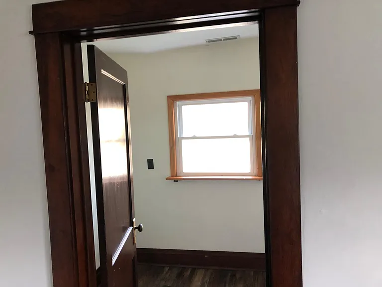 Small office or storage room off bedroom. Not another bedroom.
