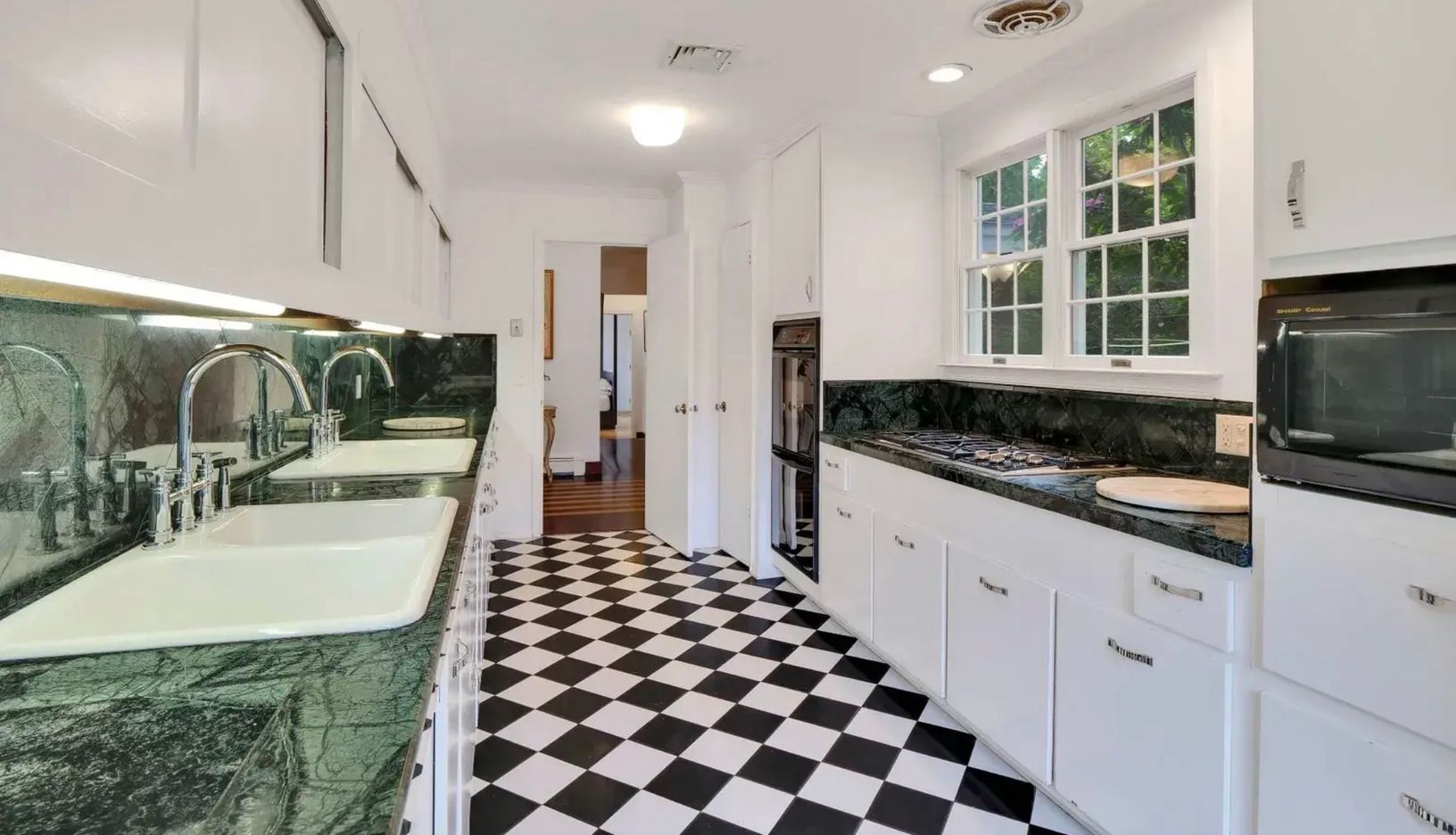  kitchen, just off of the living room, can close doors for privacy as necessary, facing main entrance