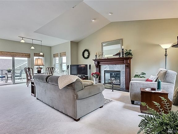 View of very spacious great room from entry, open to your dining room with patio doors to your just-refinished deck!