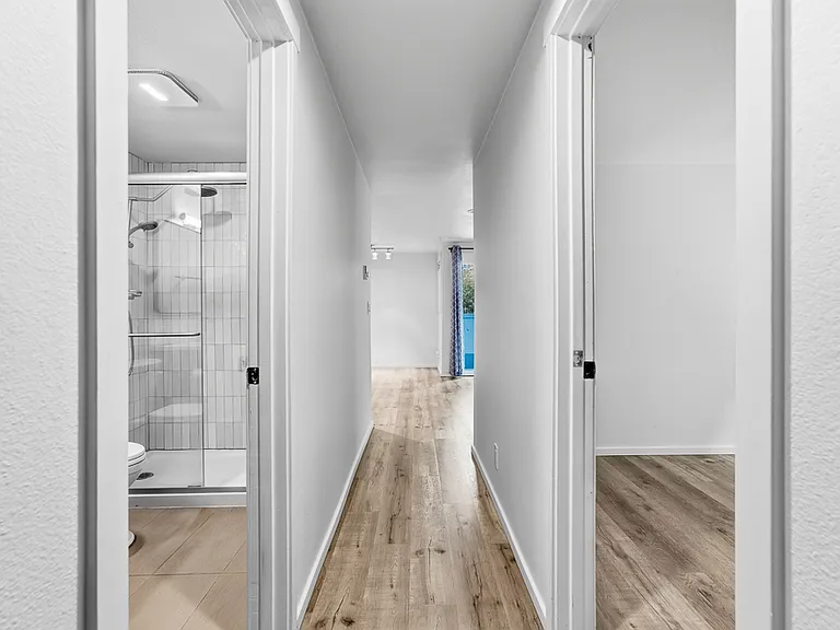 Hall way to living room & kitchen