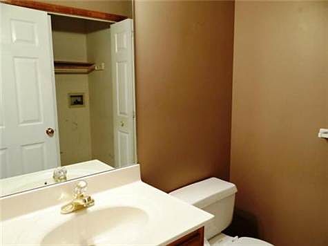 Main Level Half Bath With Laundry Room Area