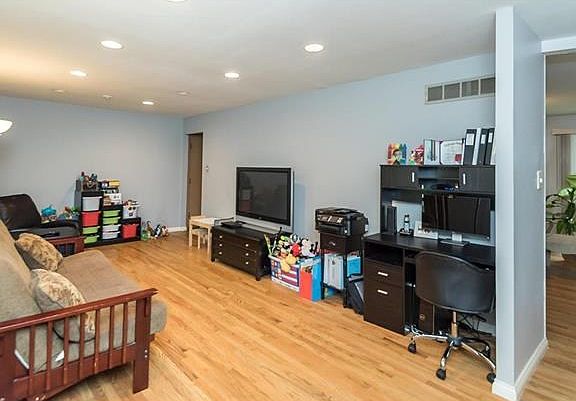 From the Entry Foyer you have a view of the Great Room.  Owners are currently waiting for their new furniture to be delivered.  Extensive recessed lighting was added to this space for great ambient lighting.  The original design of this area was for a Liv
