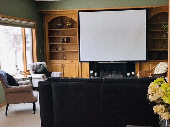 Drop down screen theatre! Cabinet behind it for another t.v. if preferred. Surround sound with sub.