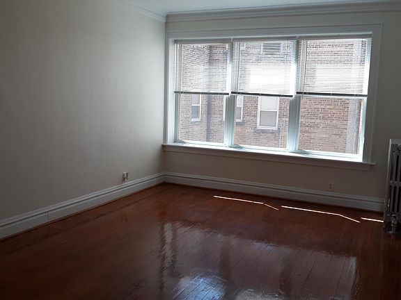 Huge living room with beautiful new windows.
