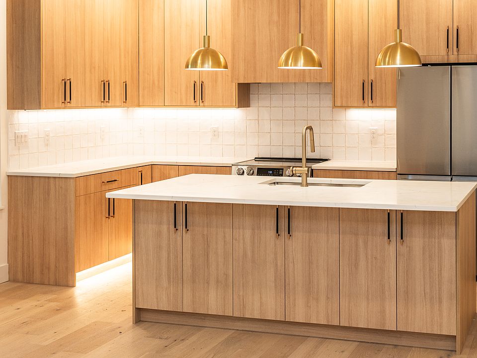 Chef's kitchen! White oak cabinets and high end quartz countertops.