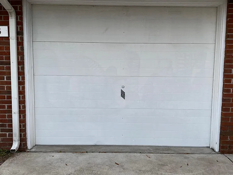 one of two parking spaces is in a garage with remote